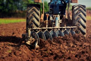 A tractor ploughing a field